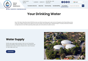 Screenshot of a webpage from Walnut Valley Water District showing information about drinking water, with an aerial photo of water storage tanks and a button labeled 