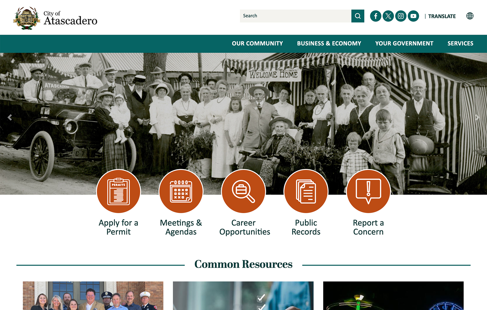 Black and white historical photo of a group of people in early 20th-century attire with an old car, displayed on the City of Atascadero website homepage above navigation icons.