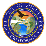 City of Pinole, California seal with an eagle flying over a river and hills, set against a sunset sky. The text reads “City of Pinole 1903 California.”.