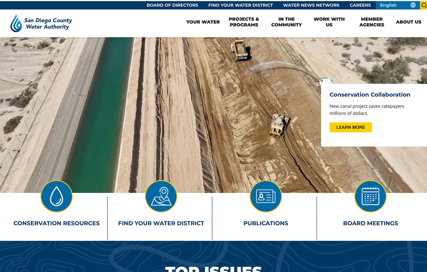 Aerial view of construction vehicles working beside a water canal; website header and navigation links for the San Diego County Water Authority are visible at the top.