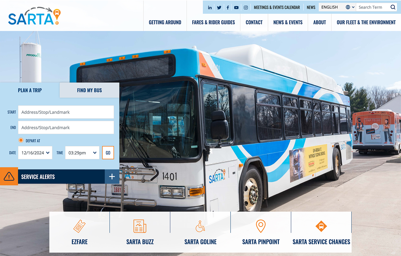 A SARTA public transit bus parked outdoors near a SARTA facility, with trip planning options and navigation menu visible on the website.