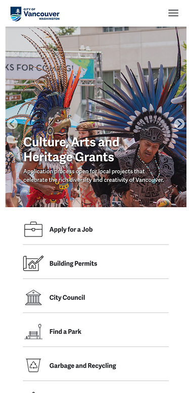 Two people in colorful feathered costumes perform at an outdoor event. Text on the image promotes culture, arts, and heritage grants in Vancouver, Washington.